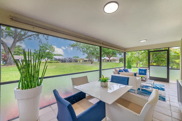 a spacious bedroom with a bed and a window