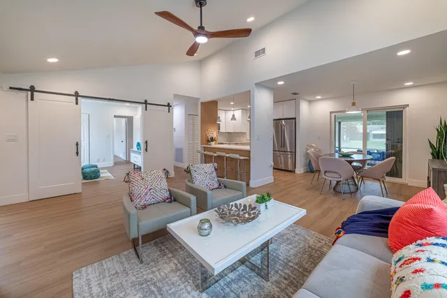 a living room with furniture and a table