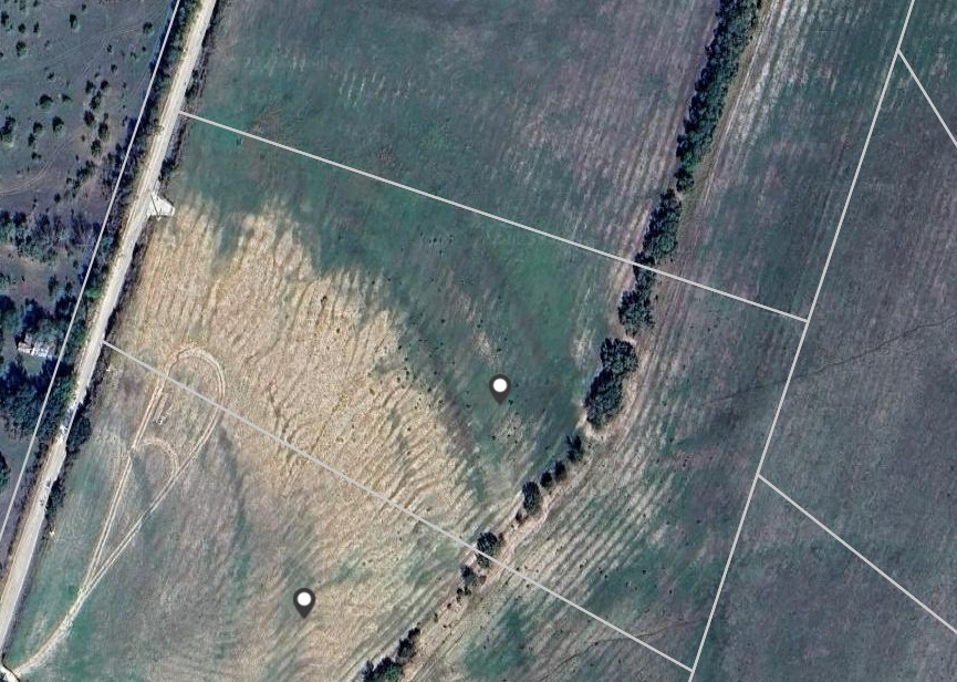 266 County Road 266 Gustine, TX 76455 - Photo 3 of 10 Overhead view reveals extensive green acreage with road access, ideal for development or agricultural pursuits.