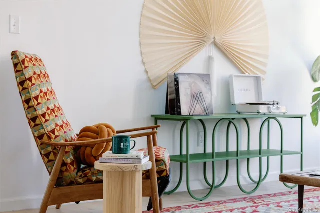 a living room filled with furniture and a large window