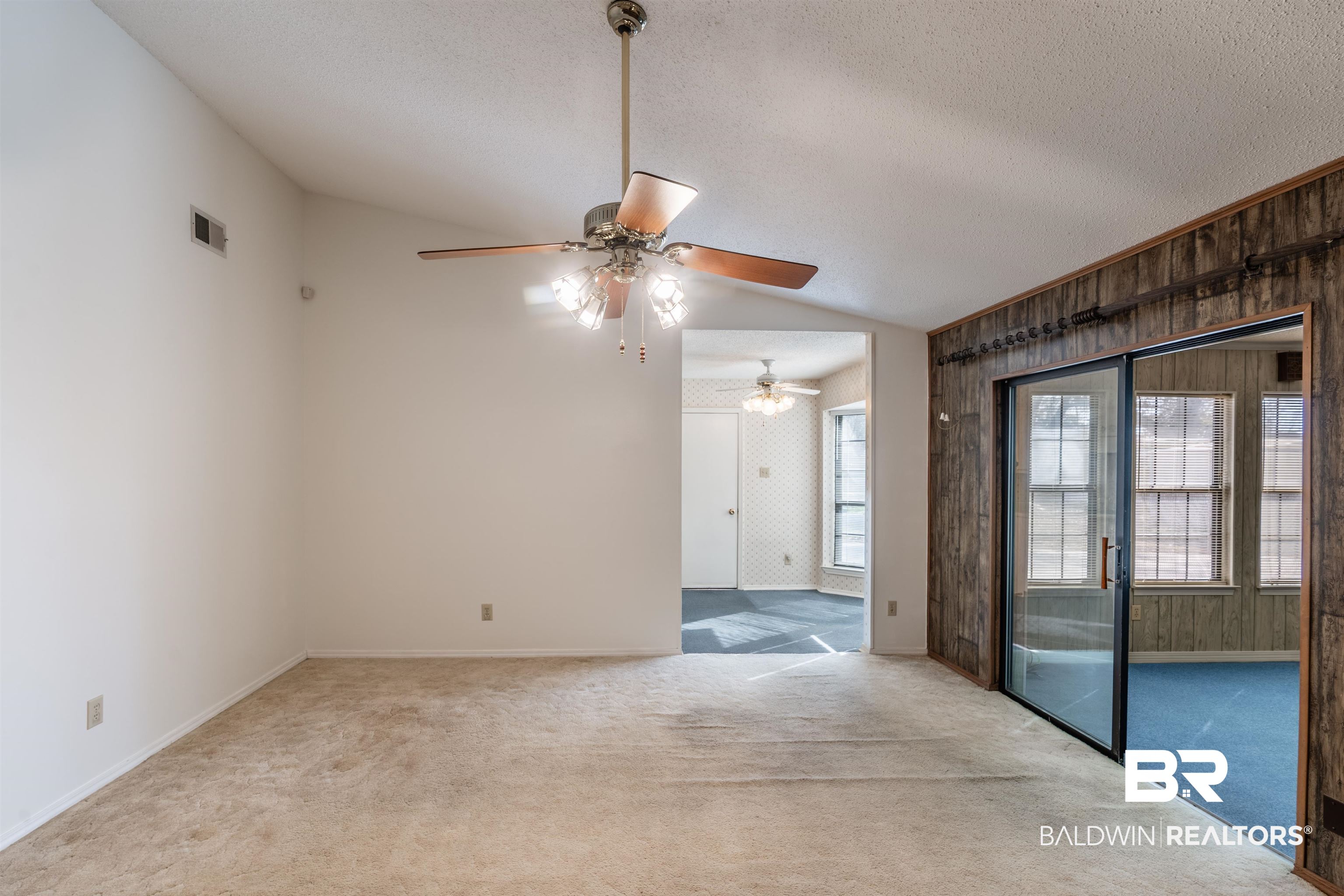9751 Pine Knoll Road Mobile, AL 36608 - Photo 6 of 36 Unfurnished room featuring carpet floors, a ceiling fan, and wallpapered walls