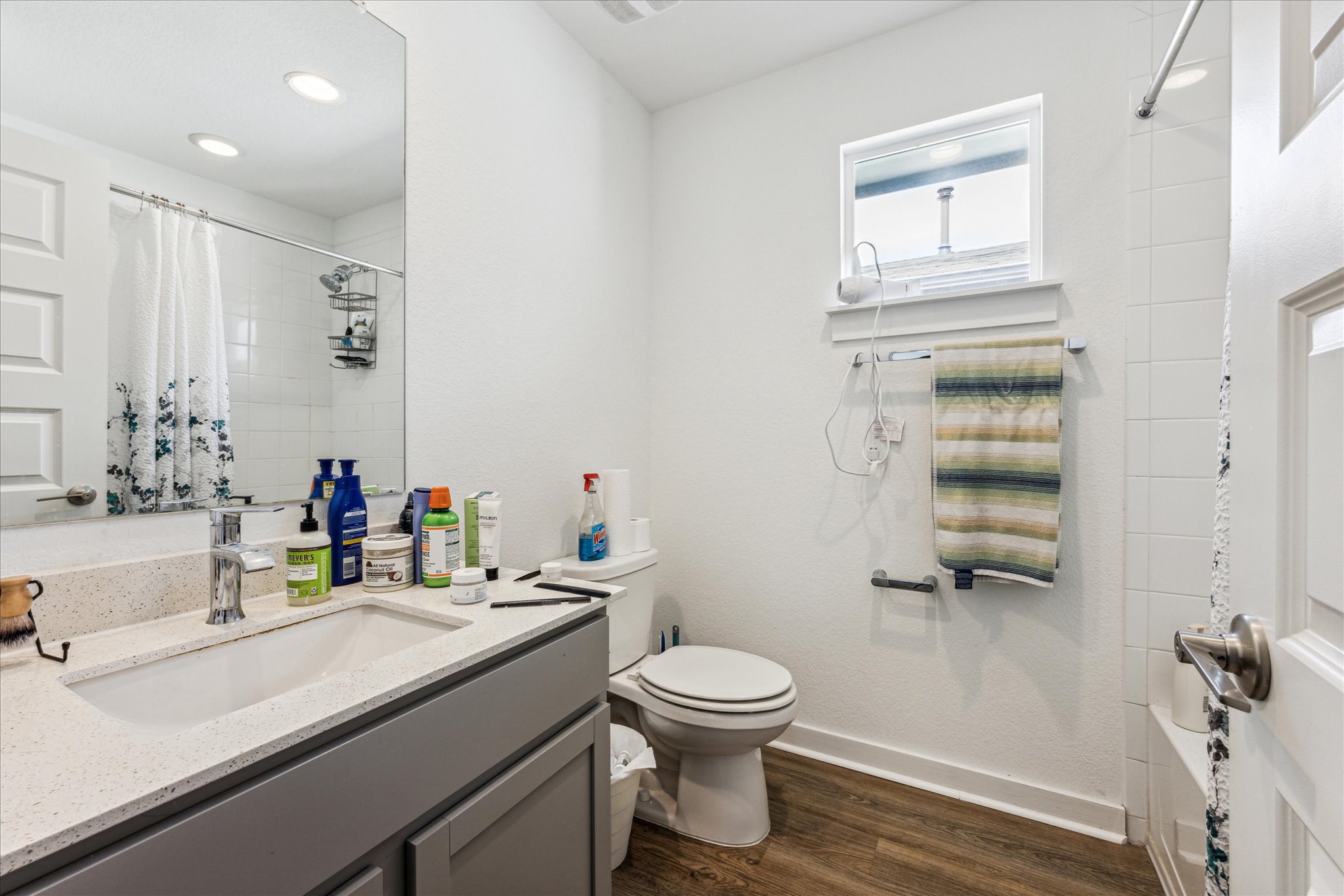 7916 Linnie Lane Austin, TX 78724 - Photo 13 of 14 a bathroom with a sink vanity mirror and toilet