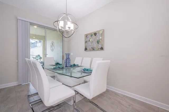 a dining room with furniture and window