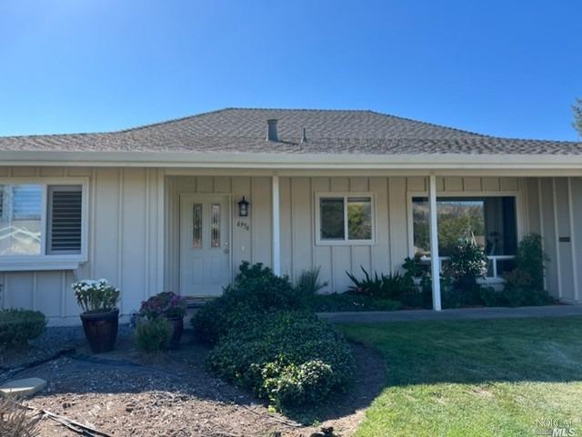 6956 Oakmont Drive Santa Rosa, CA 95409 - Photo 1 of 1 a front view of a house with a garden
