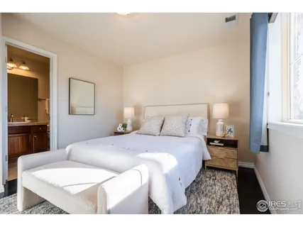 a bedroom with a bed and a view of bathroom