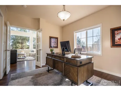a kitchen with a stove a refrigerator a sink and dishwasher with wooden floor