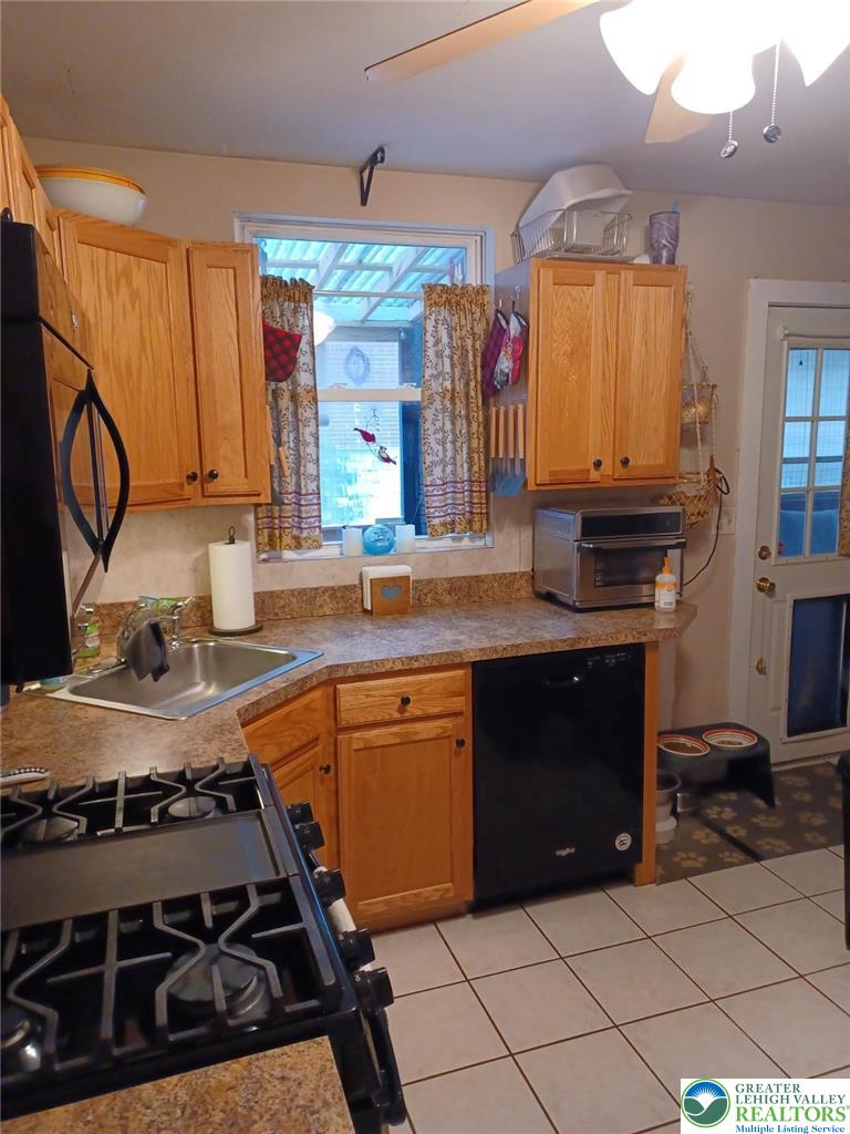 2543 South Law Street Allentown, PA 18103 - Photo 3 of 17 a kitchen with stainless steel appliances granite countertop a stove and a sink