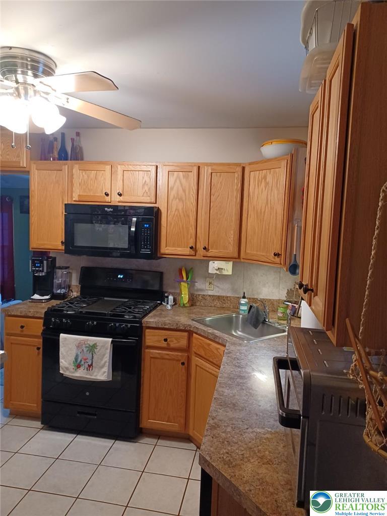 2543 South Law Street Allentown, PA 18103 - Photo 4 of 17 a kitchen with a stove and a refrigerator
