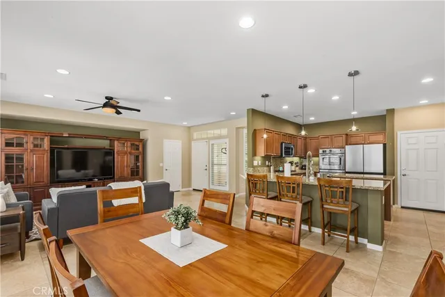 a living room with lots of furniture and kitchen view