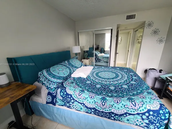 a bedroom with a bed and furniture