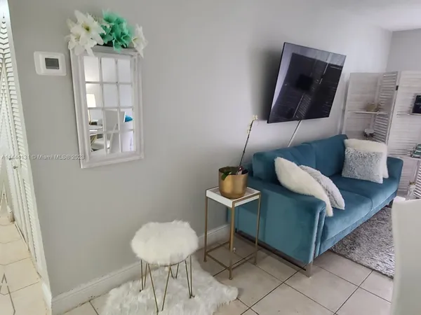 a living room with furniture and a rug