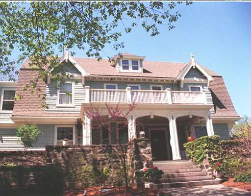 73 Dean Road Brookline, MA 02445 - Photo 1 of 7 a front view of a house with a garden