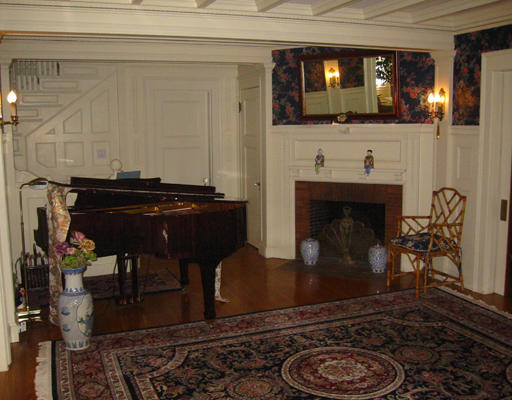 73 Dean Road Brookline, MA 02445 - Photo 4 of 7 a living room with furniture a flat screen tv and a fireplace
