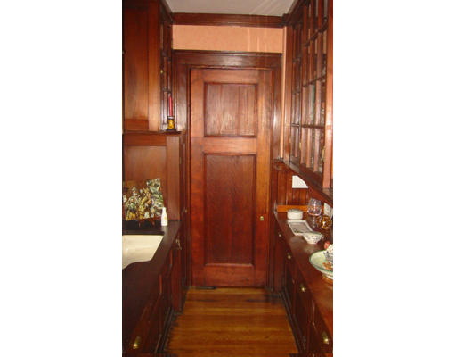 73 Dean Road Brookline, MA 02445 - Photo 5 of 7 a view of a hallway with wooden floor