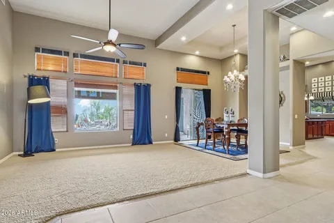 a living room with furniture a fireplace and a table