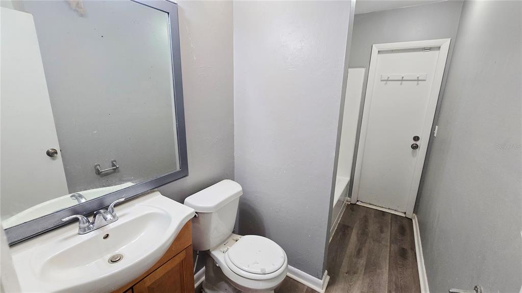 3410 15th Street Southwest Lehigh Acres, FL 33976 - Photo 28 of 31 a bathroom with a sink a toilet and shower