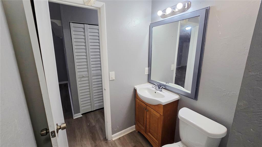 3410 15th Street Southwest Lehigh Acres, FL 33976 - Photo 29 of 31 a bathroom with a toilet sink and mirror