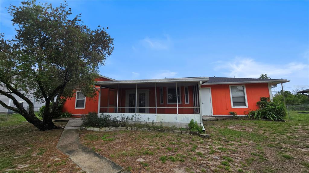 3410 15th Street Southwest Lehigh Acres, FL 33976 - Photo 31 of 31 a front view of a house with garden