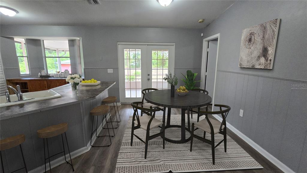 3410 15th Street Southwest Lehigh Acres, FL 33976 - Photo 6 of 31 a view of a dining room with furniture and window