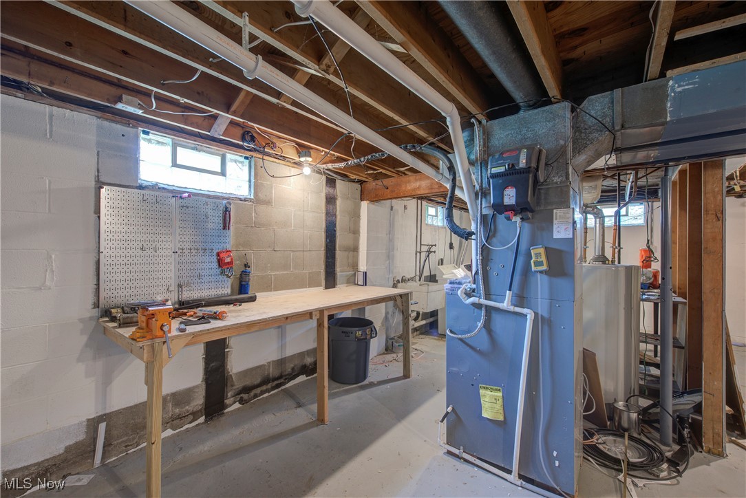 7835 Elyria Road Medina, OH 44256 - Photo 31 of 46 Basement featuring a workshop area and heating unit