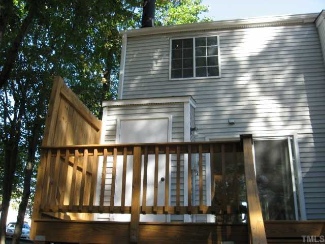 7721 Kingsberry Court Raleigh, NC 27615 - Photo 3 of 11 Nice quiet deck has utility room for extra storage.