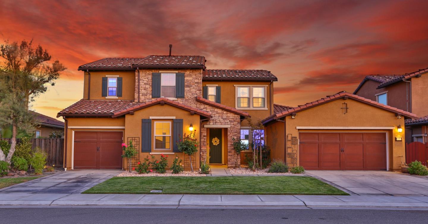 4192 Chiavari Way Manteca, CA 95337 - Photo 3 of 67 a front view of a house with garden