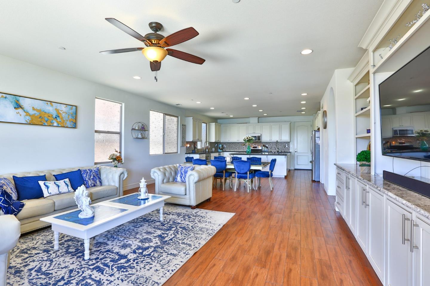 4192 Chiavari Way Manteca, CA 95337 - Photo 32 of 67 a living room with furniture and kitchen view