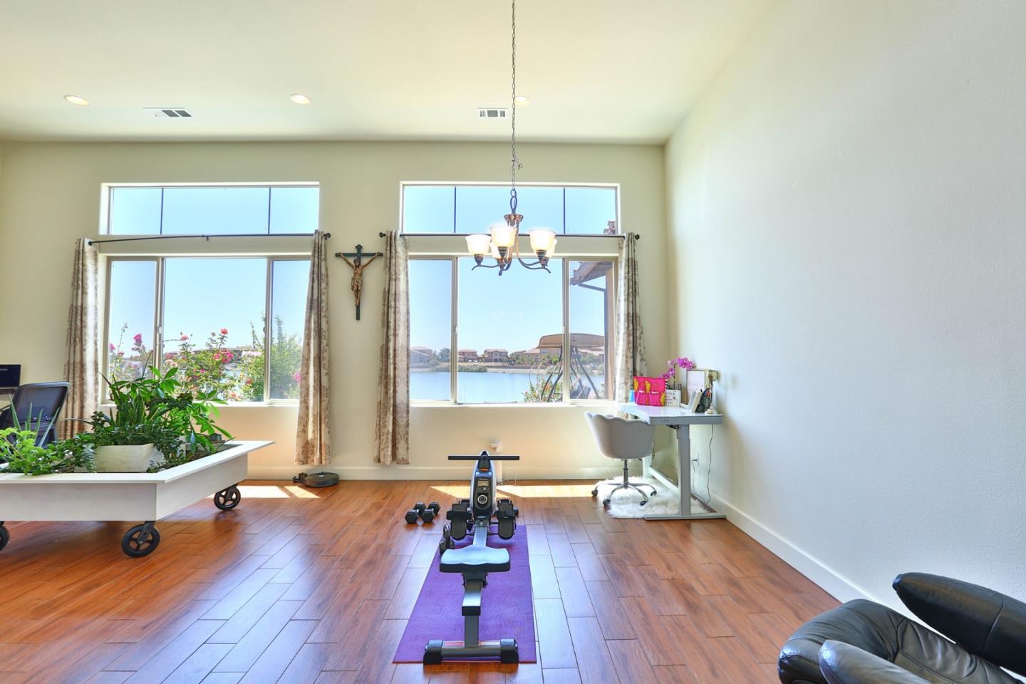 4192 Chiavari Way Manteca, CA 95337 - Photo 35 of 67 a living room with furniture and a large window