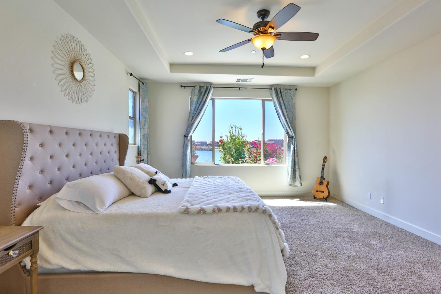 4192 Chiavari Way Manteca, CA 95337 - Photo 42 of 67 a bedroom with a bed and a chandelier