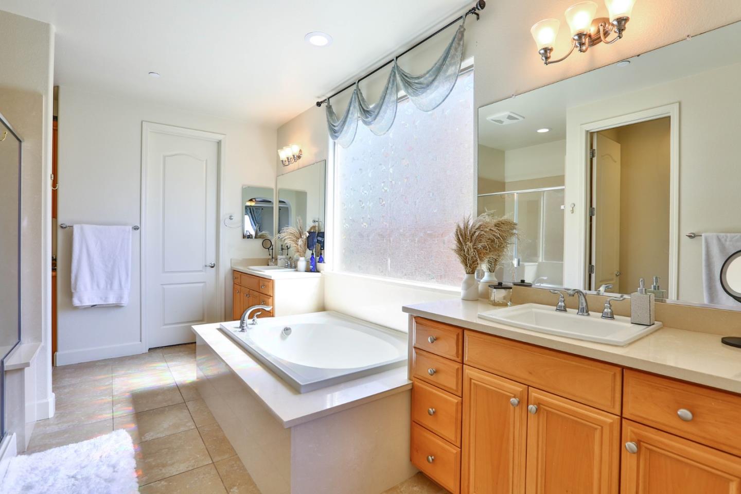4192 Chiavari Way Manteca, CA 95337 - Photo 43 of 67 a bathroom with a sink and a mirror
