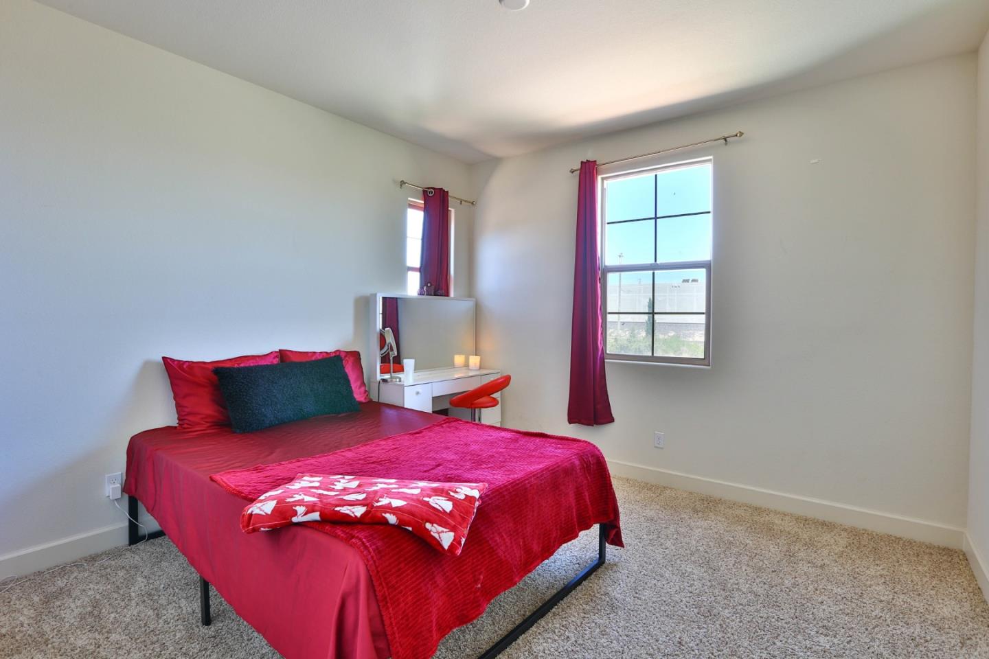 4192 Chiavari Way Manteca, CA 95337 - Photo 48 of 67 a bed sitting in a bedroom next to a window