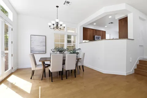 a dining room with furniture and window