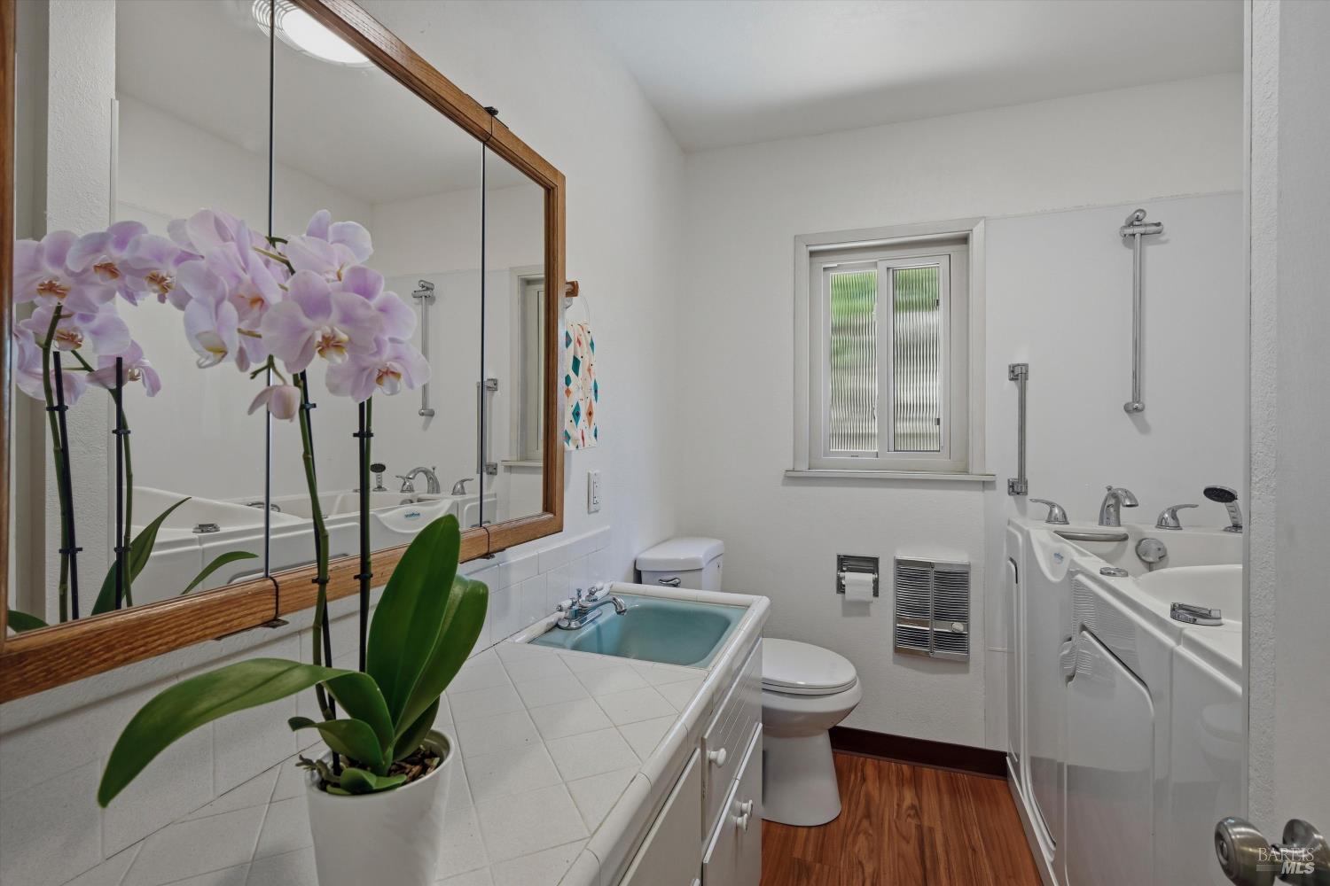 4941 Hansen Drive Santa Rosa, CA 95409 - Photo 15 of 35 Hall bathroom has new LVP flooring and a walk-in tub
