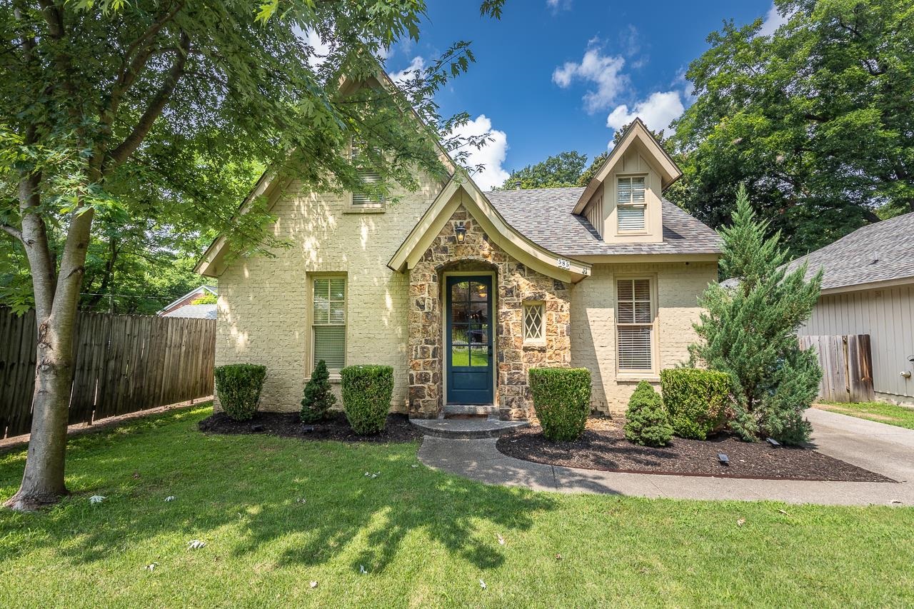 a front view of a house with garden