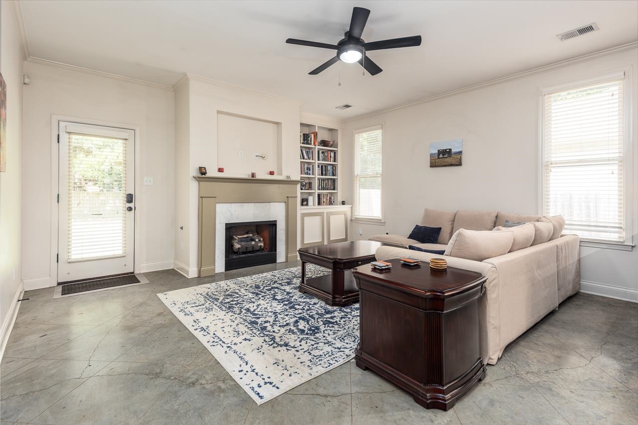 585 Alexander Street Memphis, TN 38111 - Photo 11 of 30 a living room with furniture a window and a fireplace