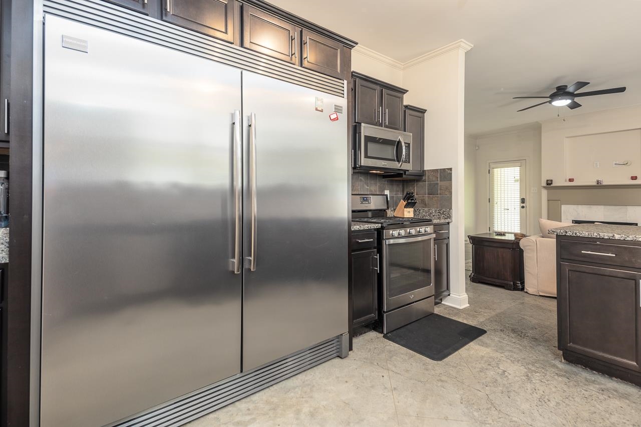 585 Alexander Street Memphis, TN 38111 - Photo 14 of 30 a kitchen with a refrigerator and a refrigerator