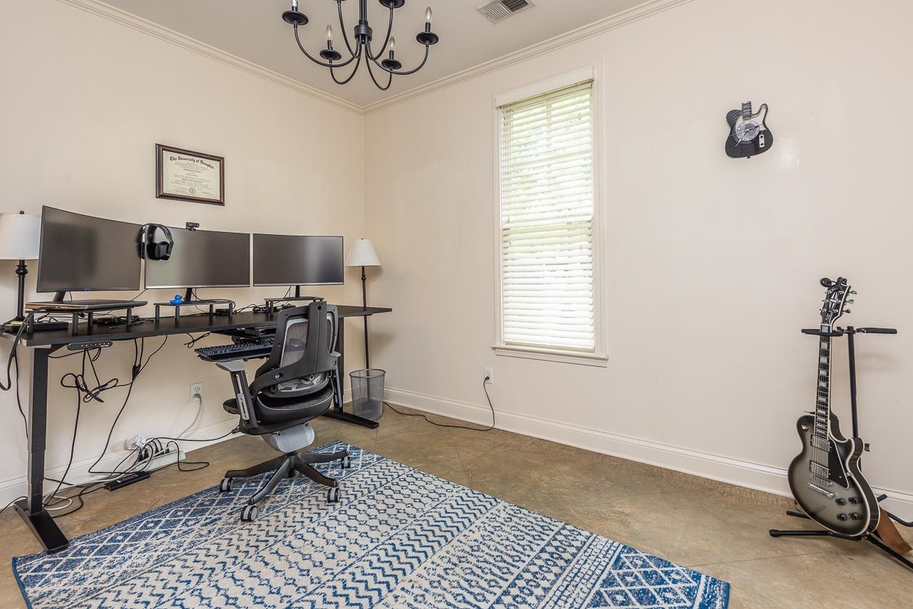585 Alexander Street Memphis, TN 38111 - Photo 18 of 30 a view of a workspace with furniture and a window