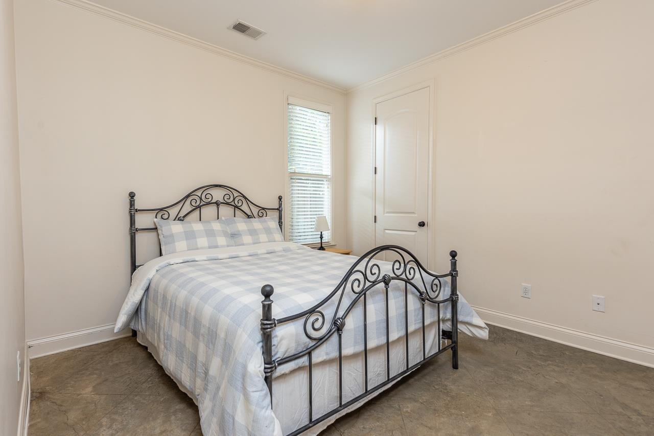 585 Alexander Street Memphis, TN 38111 - Photo 19 of 30 a bedroom with a bed and a window