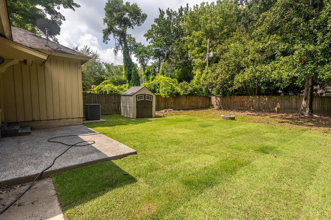 585 Alexander Street Memphis, TN 38111 - Photo 23 of 30 a swimming pool with outdoor seating and yard