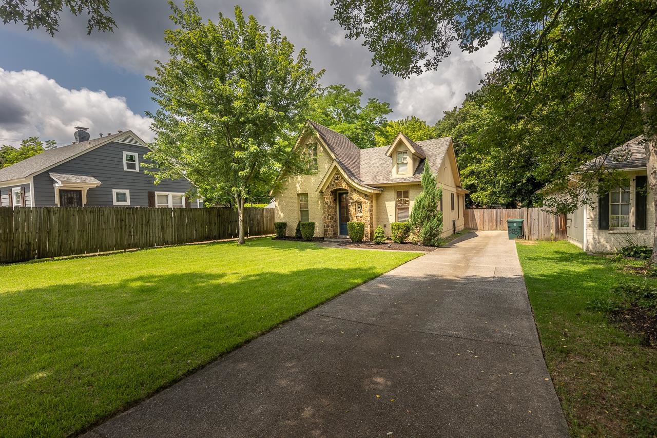 585 Alexander Street Memphis, TN 38111 - Photo 28 of 30 a front view of a house with garden and trees
