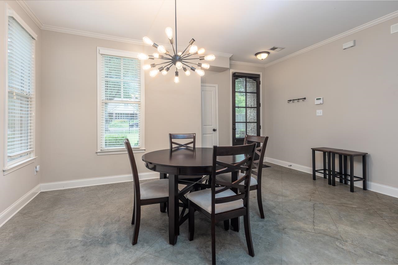 585 Alexander Street Memphis, TN 38111 - Photo 7 of 30 a view of a dining room with furniture window and wooden floor