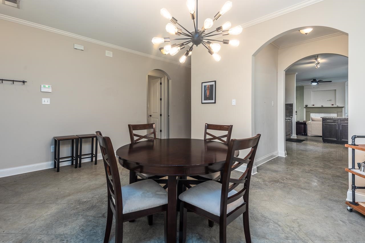585 Alexander Street Memphis, TN 38111 - Photo 8 of 30 a view of a dining room with furniture and chandelier