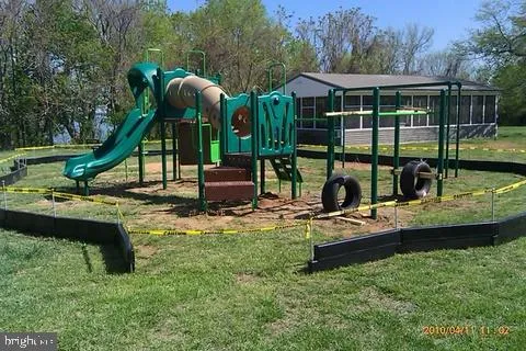 a view of a house with backyard porch and sitting area