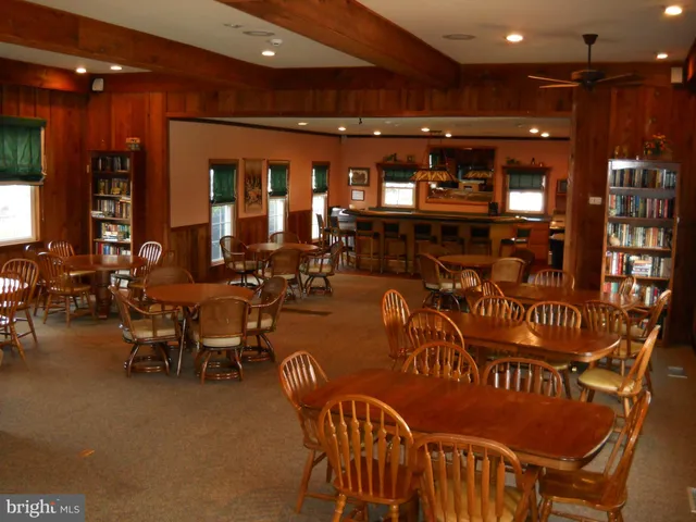 a view of a chairs and table in a room