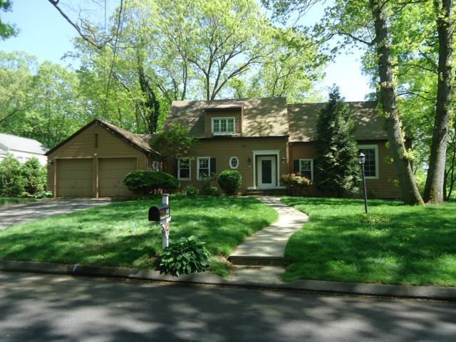 107 Harwich Road Fairfield, CT 06825 - Photo 1 of 1 a front view of a house with a yard and trees