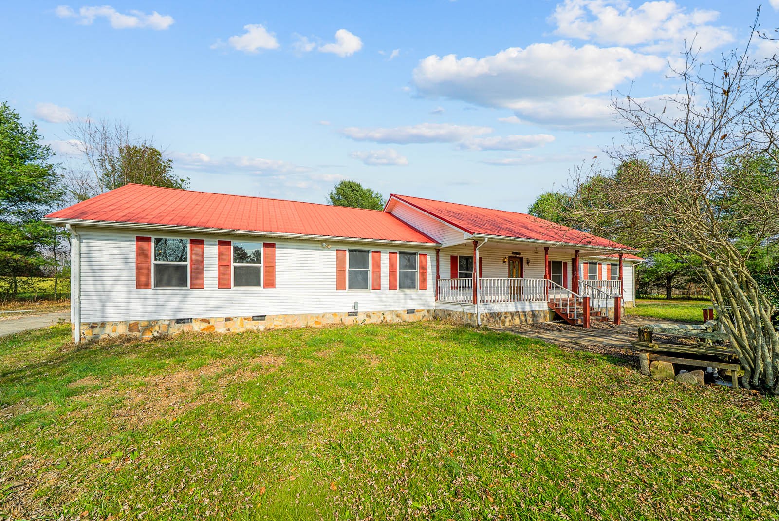 a front view of house with yard and swimming pool