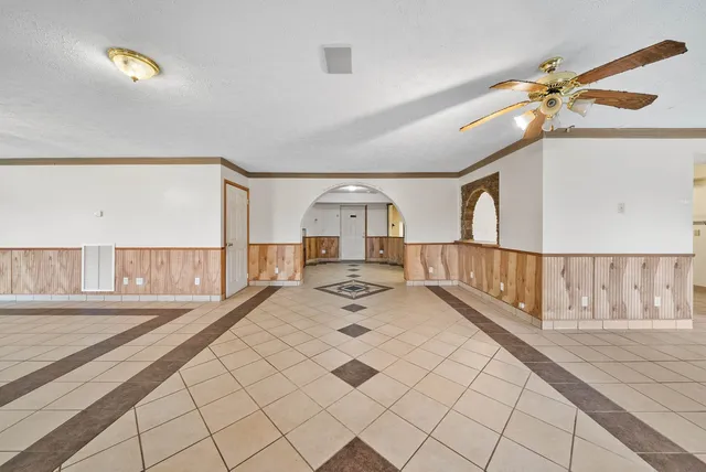 a spacious bathroom with a double vanity sink a mirror and a bathtub