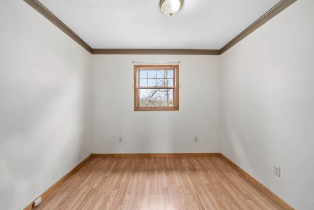 a bathroom with a sink toilet and a mirror