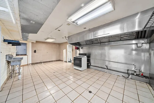 a view of an empty room and a window