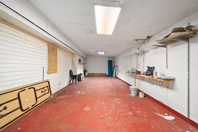 a living room with lots of furniture and a slide